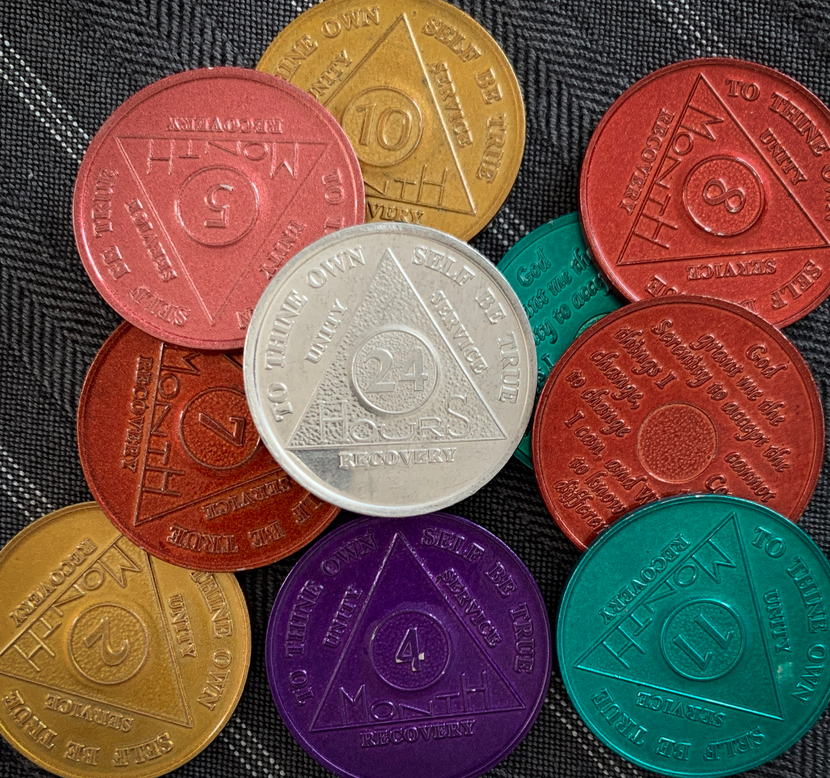 Alcoholics Anonymous chips signifying different time periods of sobriety